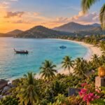Golden sunrise over a palm-fringed Koh Samui bay with turquoise water, tropical hills, boats and an elevated resort terrace