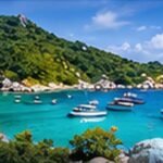 Original scenic illustration of green Koh Tao hills, granite shoreline and passenger boats on turquoise water