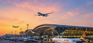 Original conceptual illustration of a Bangkok airport terminal and aircraft at sunset