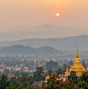 Haze over a Thai-inspired northern landscape and temple